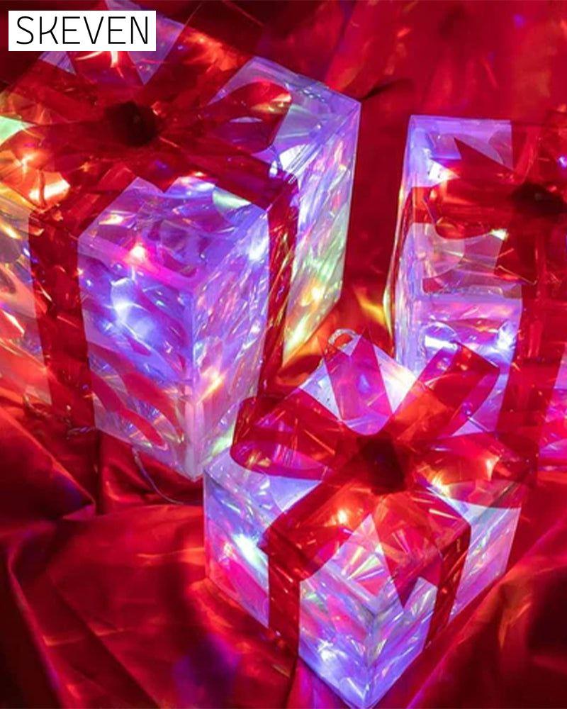 Weihnachtsdekorationen in Form von leuchtenden Geschenkboxen