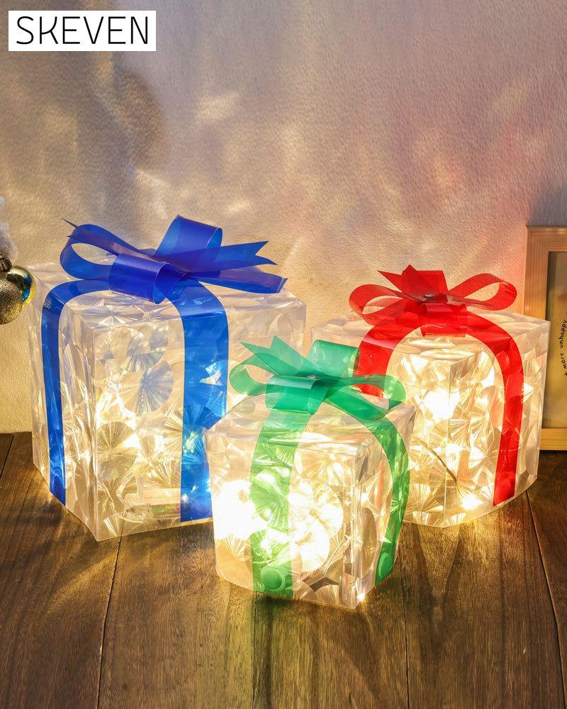 Weihnachtsdekorationen in Form von leuchtenden Geschenkboxen