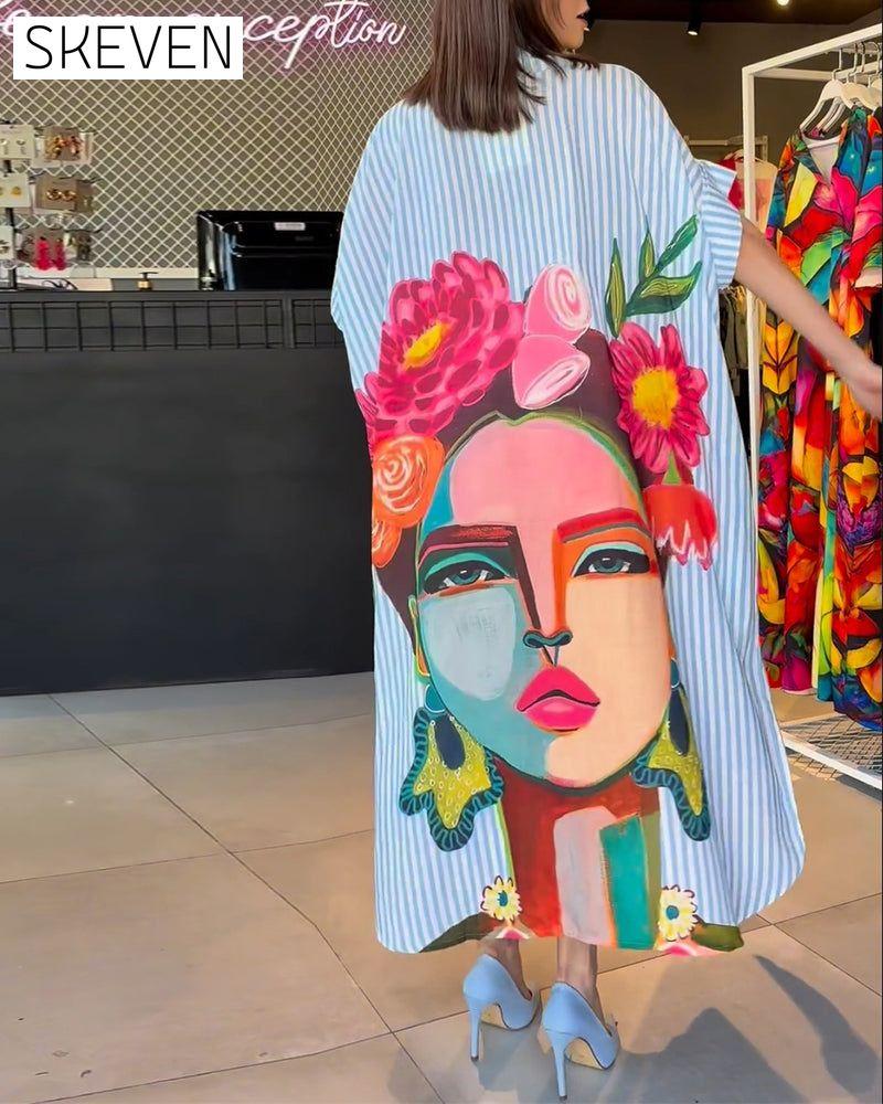 Bluse mit vertikalen Streifen und Charakterprint, Reversschlitz