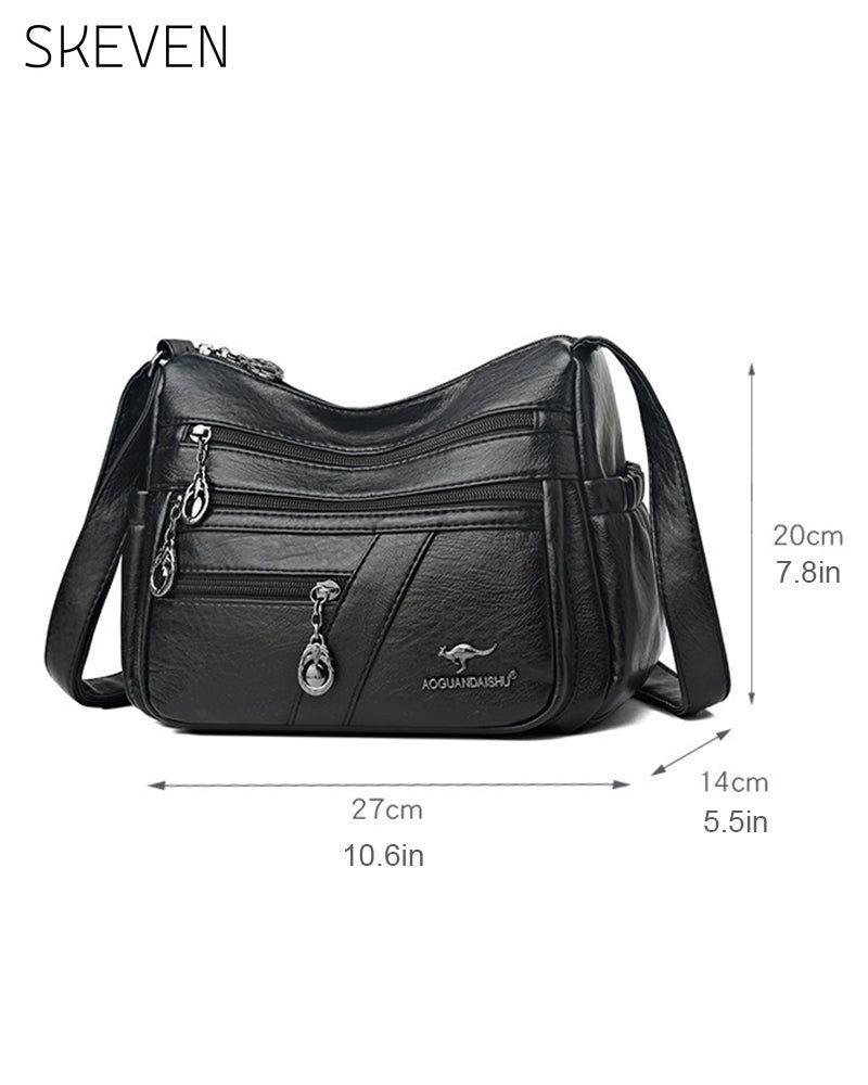 Sac bandoulière en cuir souple multipoches