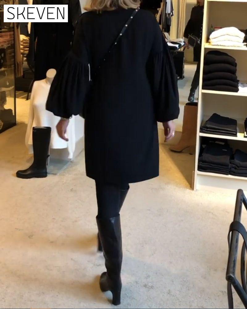 Classic black dress with lantern sleeves