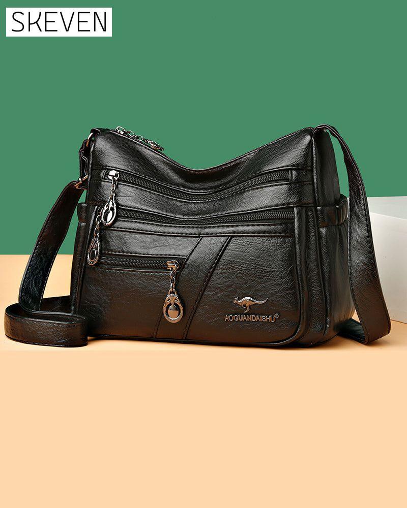 Sac bandoulière en cuir souple multipoches