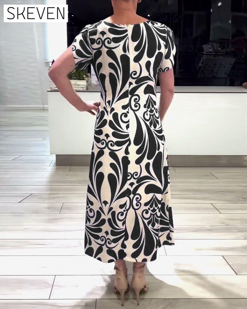 Elegantes Kurzarmkleid mit Kontrastprint