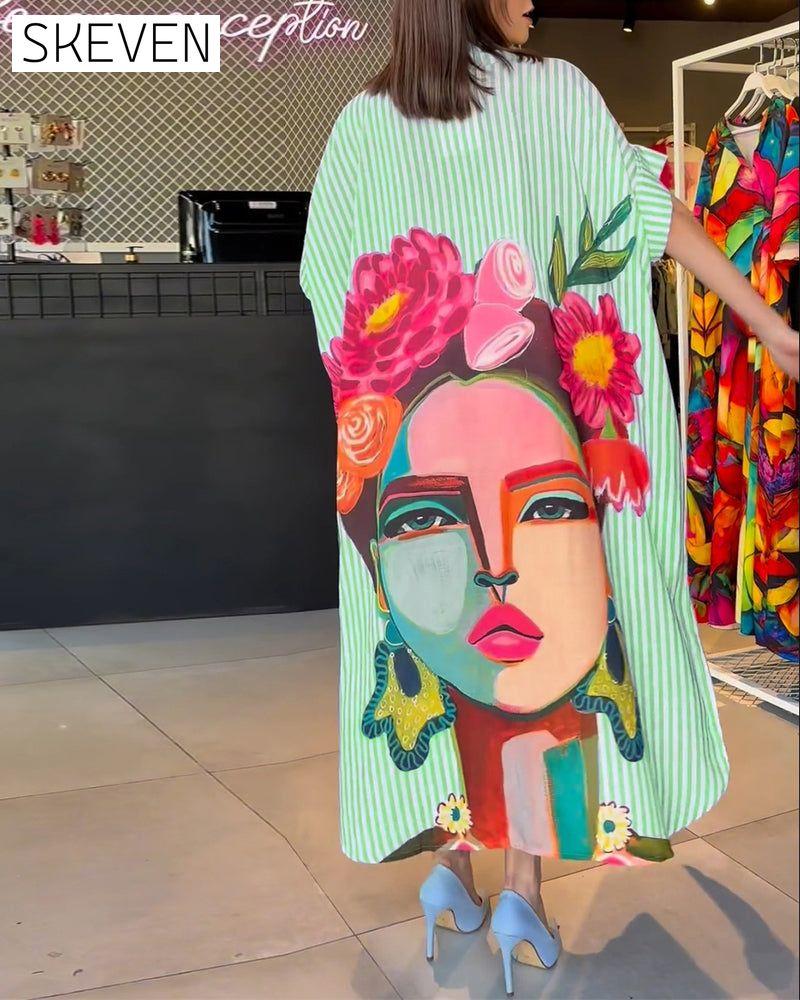 Bluse mit vertikalen Streifen und Charakterprint, Reversschlitz