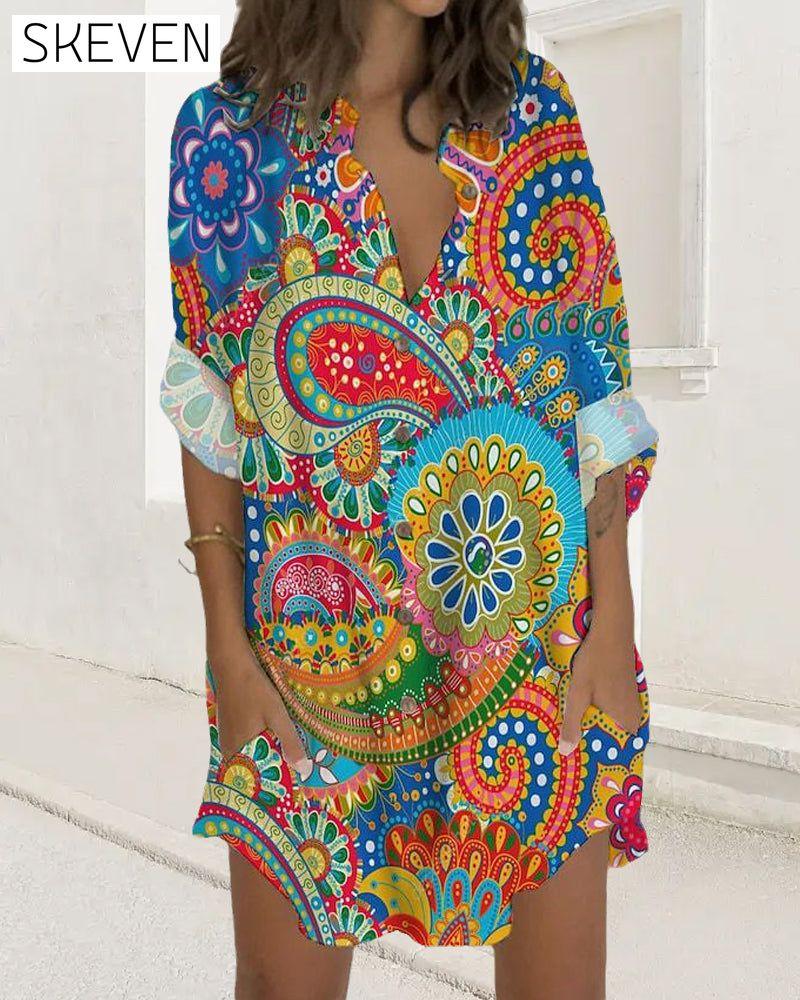 Bedrucktes Kleid mit Knöpfen, langen Ärmeln und Taschen