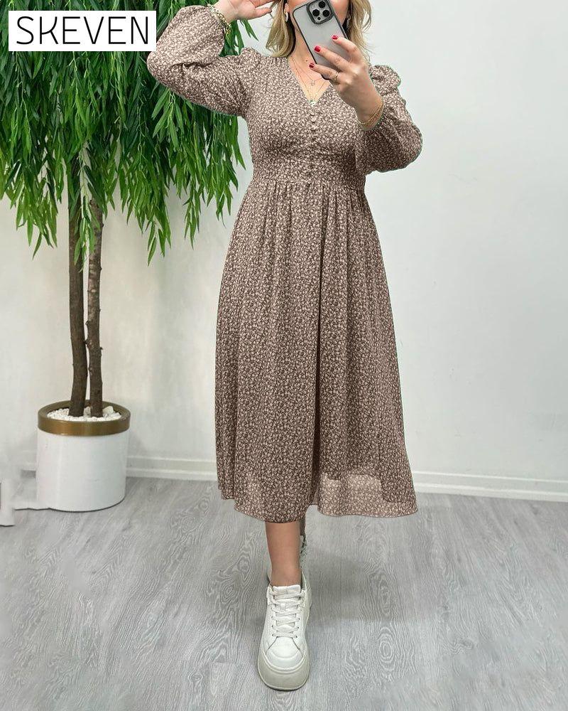 Elegantes Kleid mit Print und Knöpfen