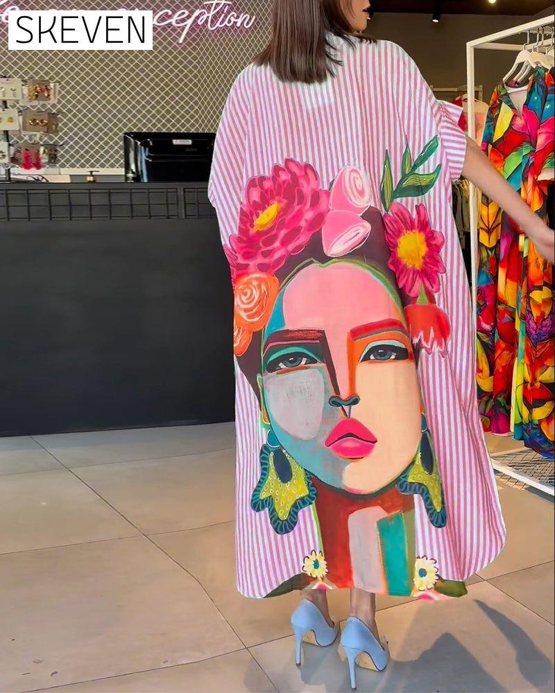 Bluse mit vertikalen Streifen und Charakterprint, Reversschlitz