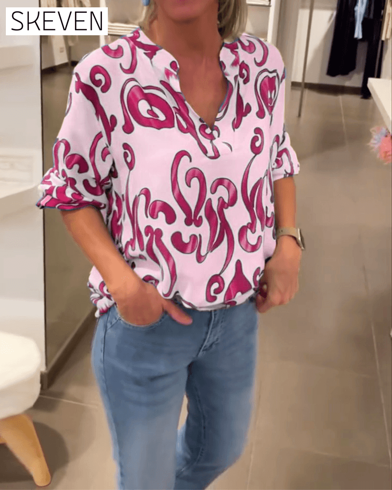 Elegant long-sleeved top with printed V-neck