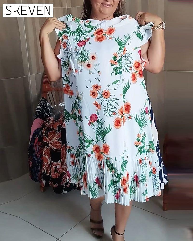 Kleid mit Einsätzen, plissiert und mit Blumenmuster