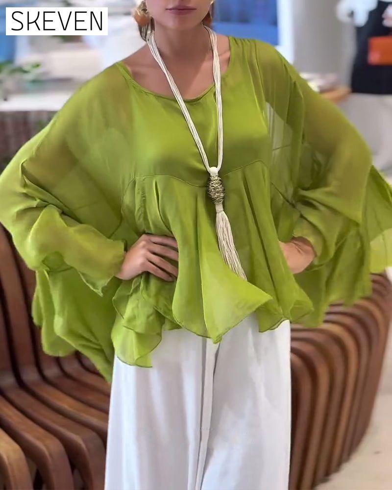 Modische Bluse in Unifarben mit schwungvollem Design