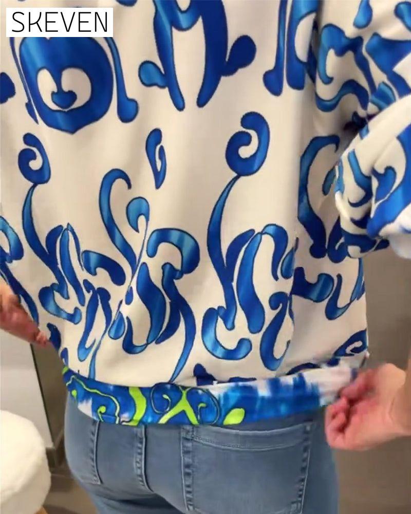 Elegant long-sleeved top with printed V-neck