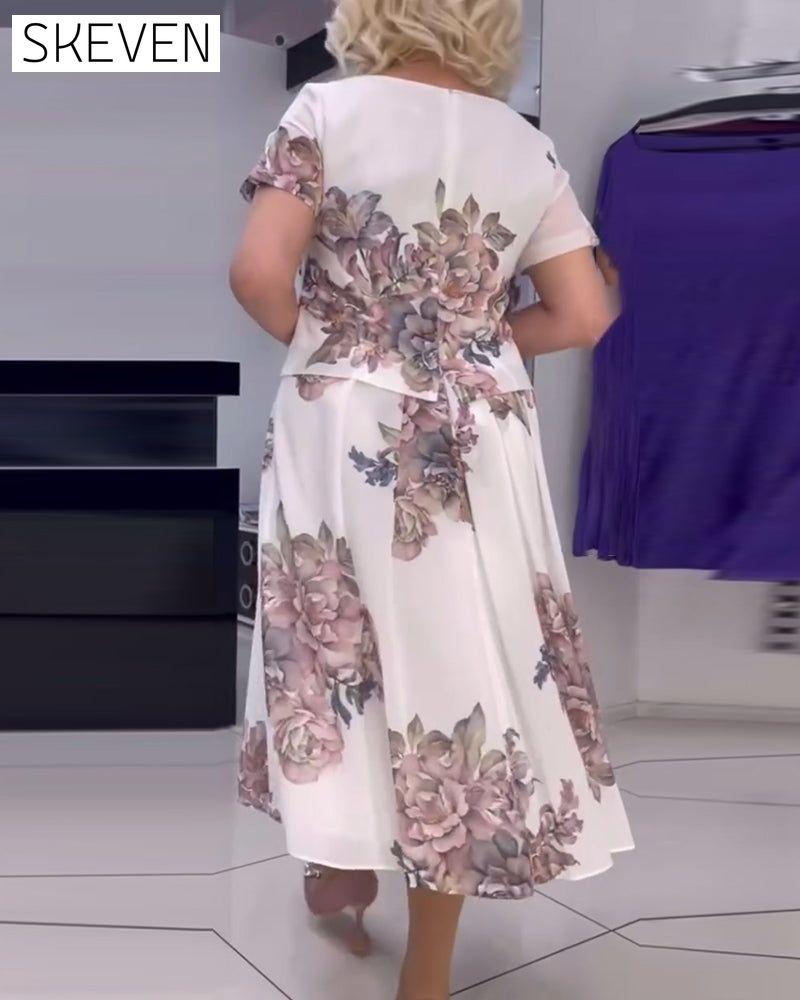 Elegantes Kleid mit Blumenmuster und Rundhalsausschnitt