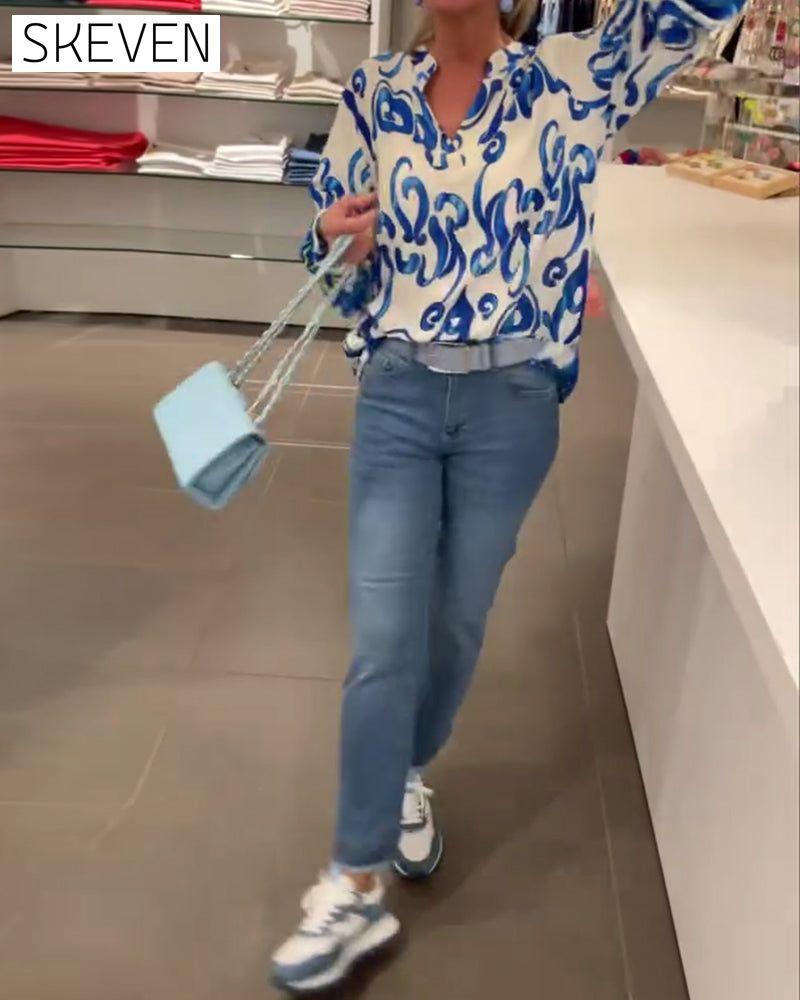 Elegant long-sleeved top with printed V-neck
