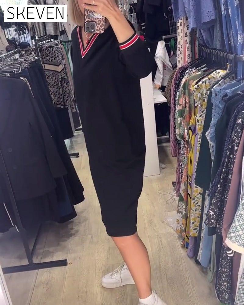 Robe élégante à col en V avec poches