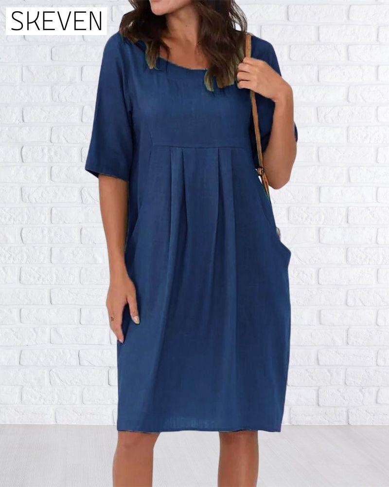 Robe unie à col rond et poches