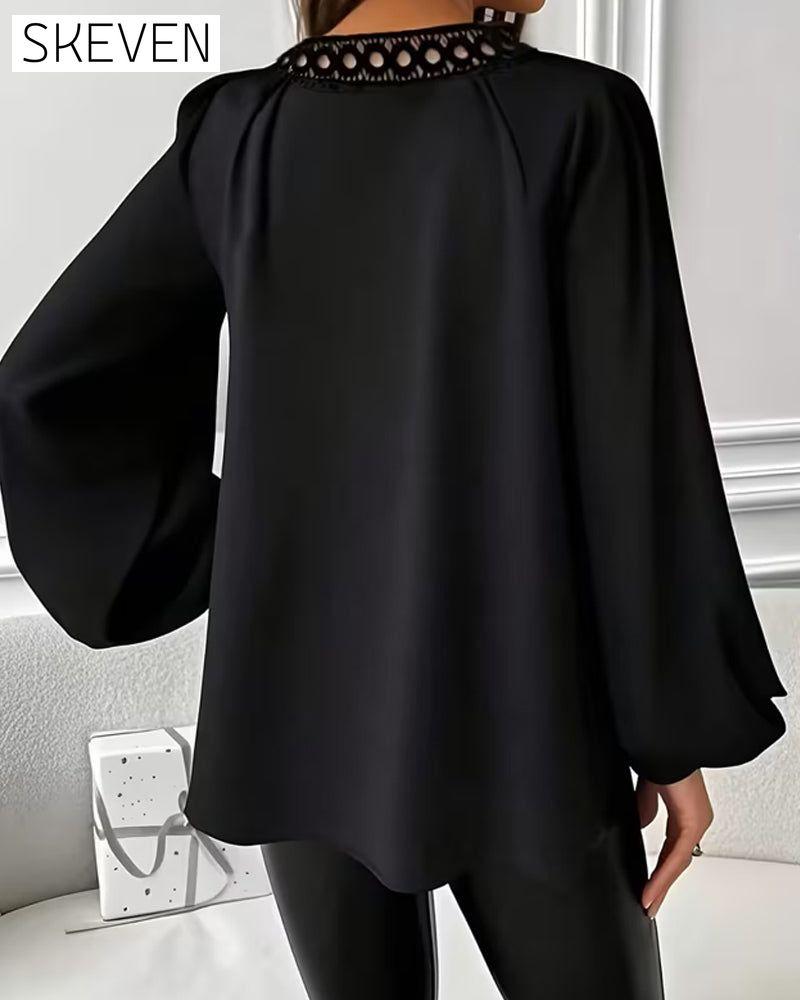 Lockere Bluse mit Laternenärmeln und V-Ausschnitt