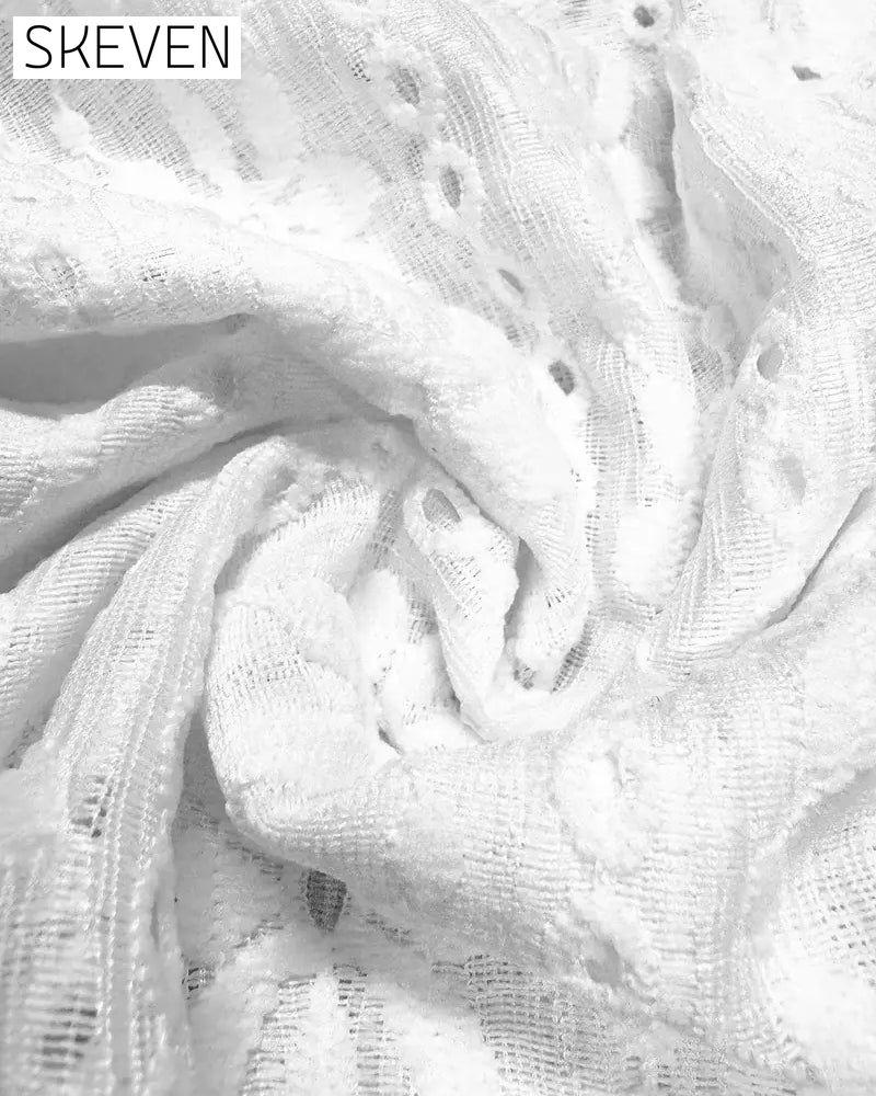 Chemisier à col rond en dentelle crochetée à manches courtes