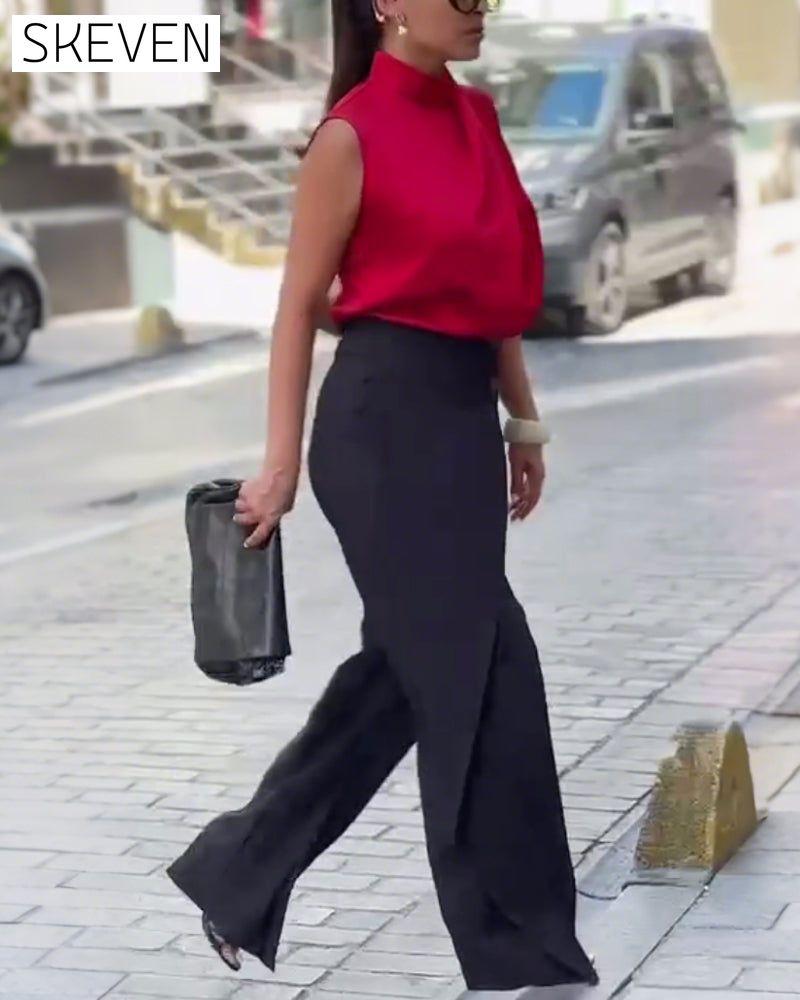 Pantalon asymétrique à jambes larges et superposées