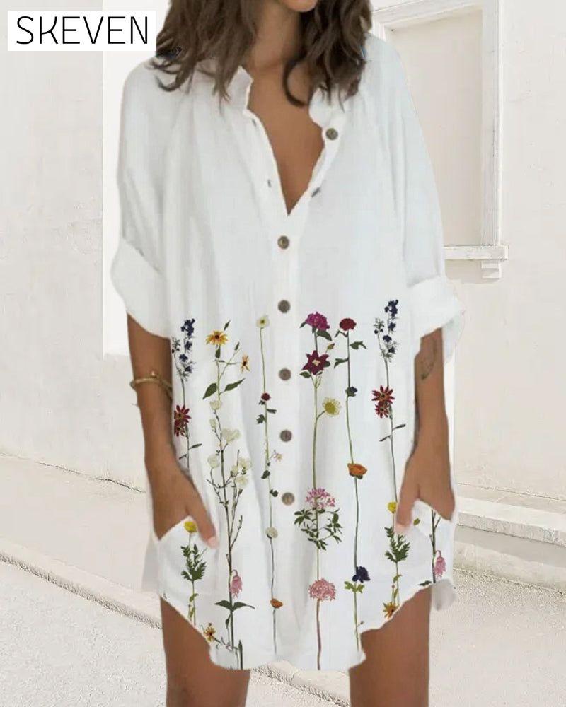 Bedrucktes Kleid mit Knöpfen, langen Ärmeln und Taschen