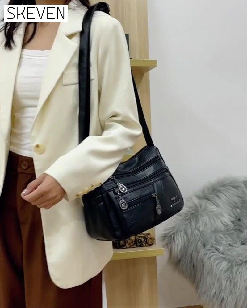 Sac bandoulière en cuir souple multipoches