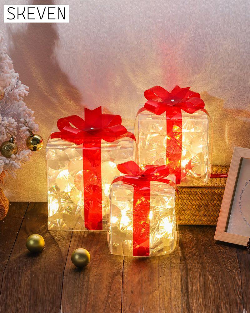 Weihnachtsdekorationen in Form von leuchtenden Geschenkboxen