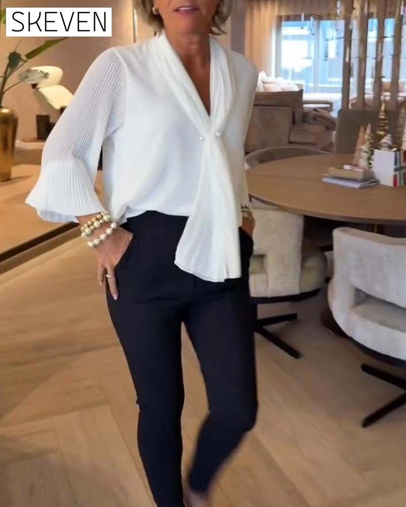 Elegante Bluse mit Glockenärmeln und Schleifen