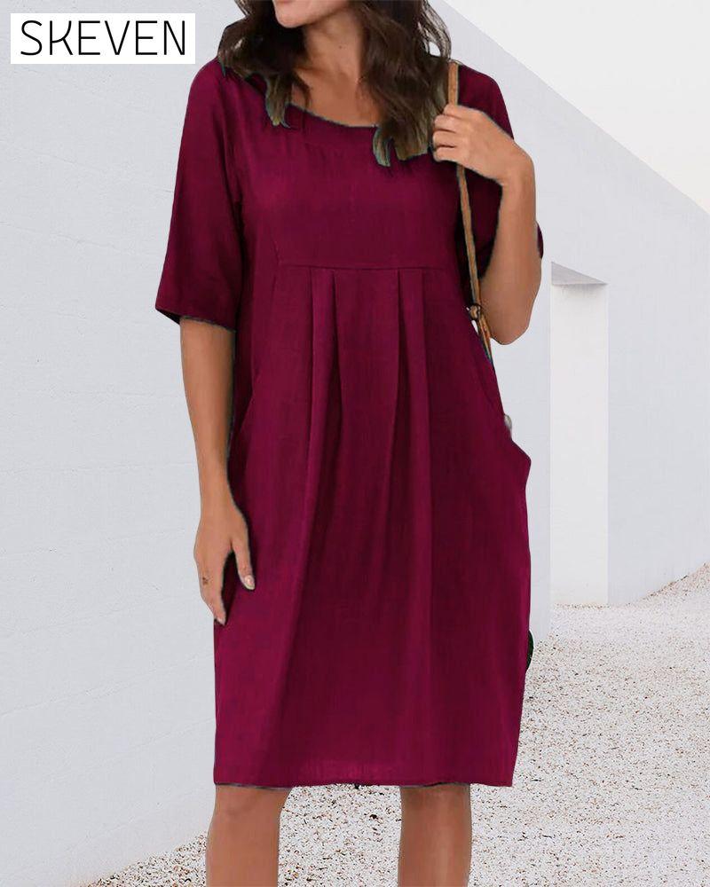 Robe unie à col rond et poches