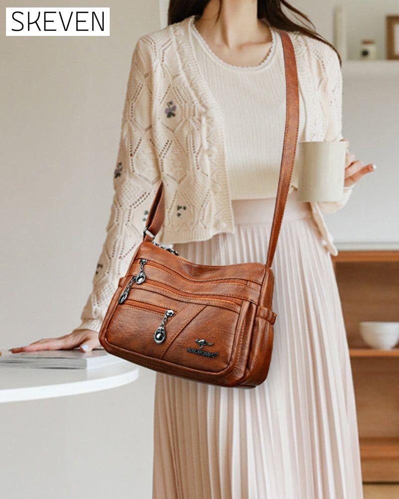 Sac bandoulière en cuir souple multipoches