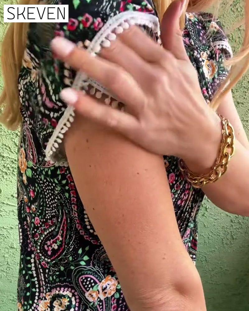 Bluse mit Blütenblattärmeln und Faltenmuster