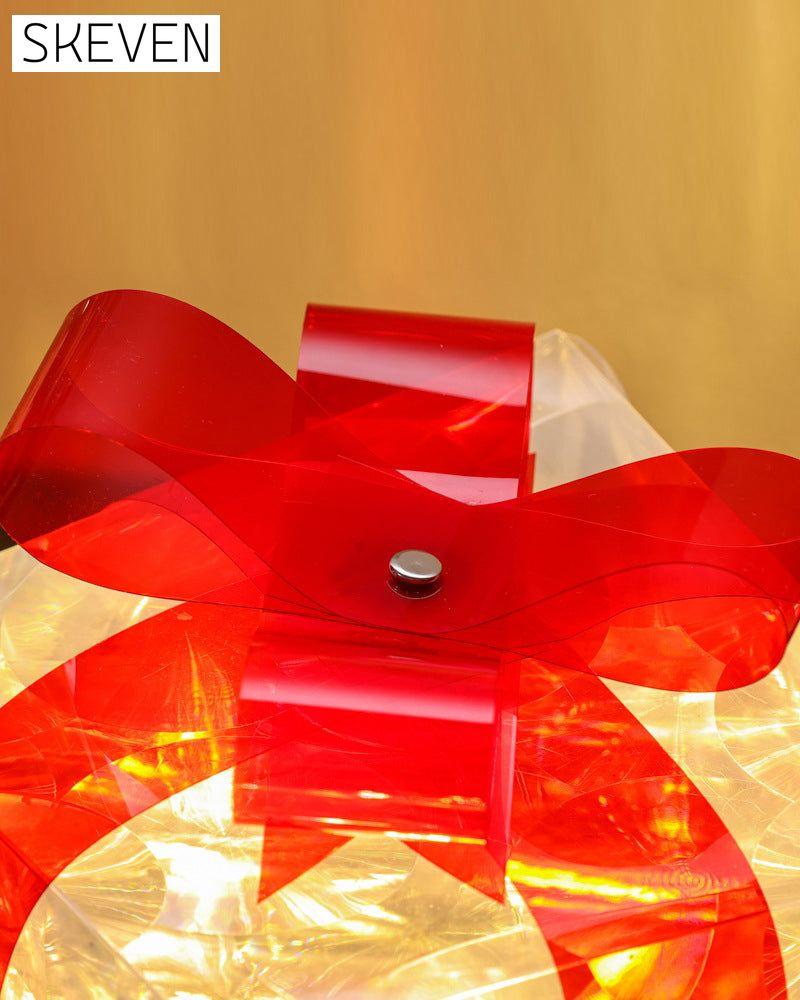 Weihnachtsdekorationen in Form von leuchtenden Geschenkboxen