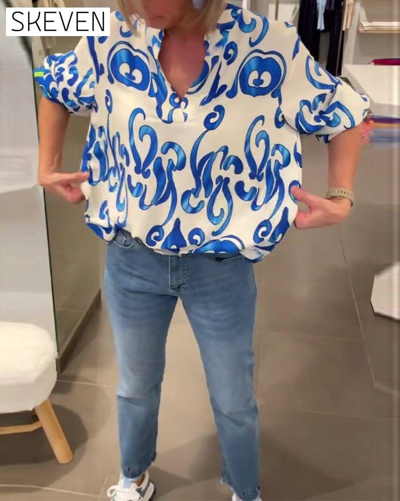 Elegant long-sleeved top with printed V-neck