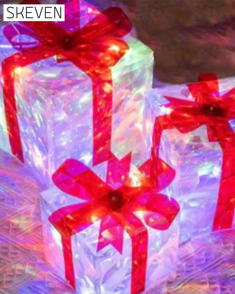 Weihnachtsdekorationen in Form von leuchtenden Geschenkboxen