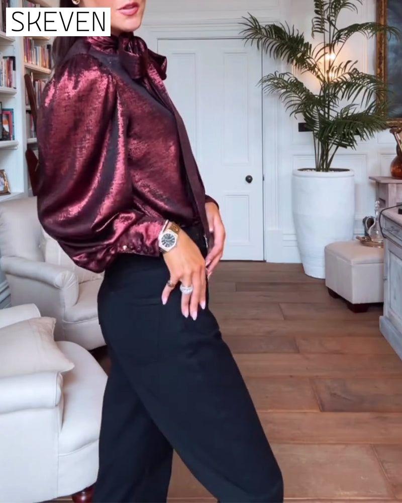Elegante Bluse mit Puffärmeln und fließendem Band