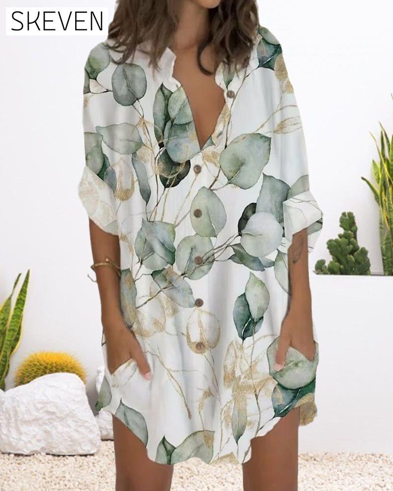 Bedrucktes Kleid mit Knöpfen, langen Ärmeln und Taschen