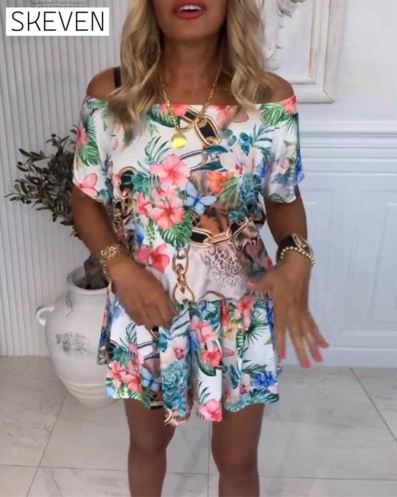 Jumpsuit mit Pflanzen- und Blumenmuster und schulterfreiem Ausschnitt