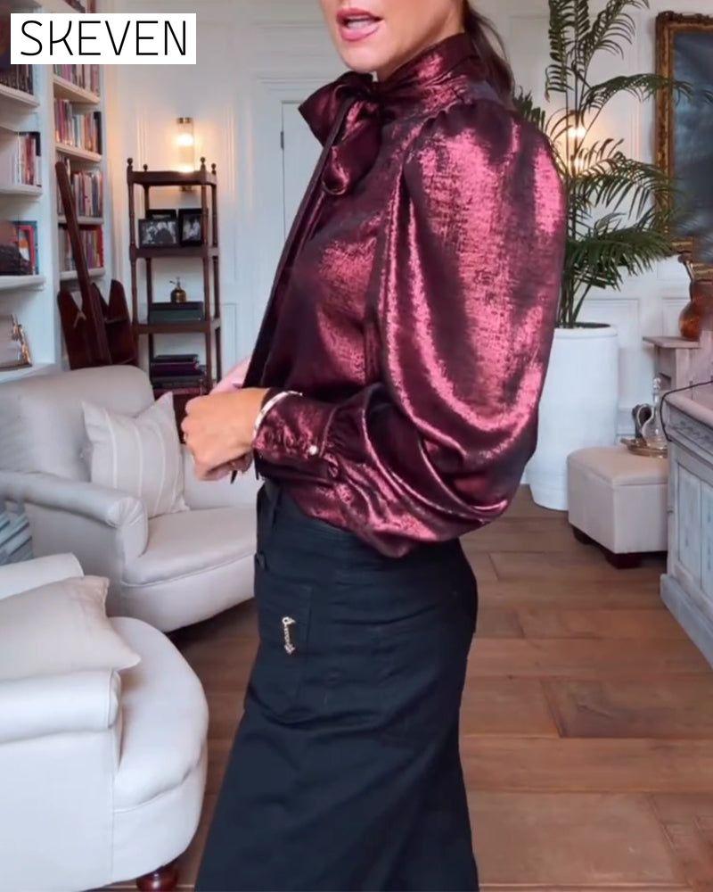 Elegante Bluse mit Puffärmeln und fließendem Band