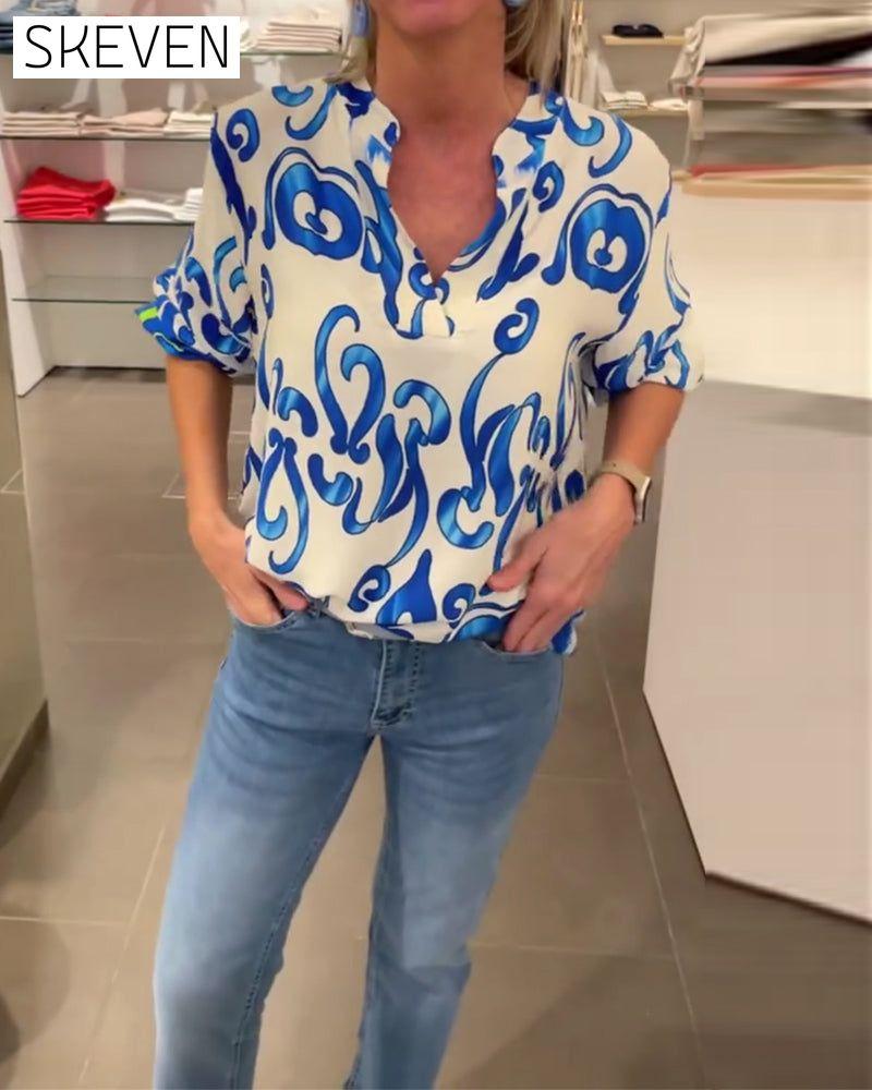 Elegant long-sleeved top with printed V-neck