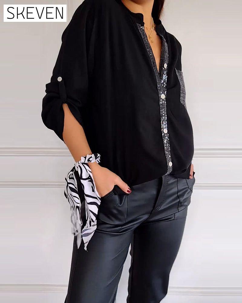 Paneled sequin button casual top