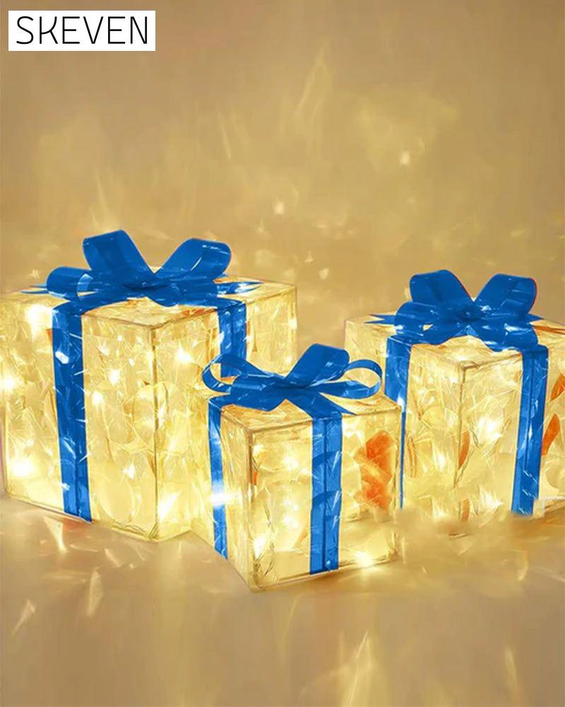 Weihnachtsdekorationen in Form von leuchtenden Geschenkboxen
