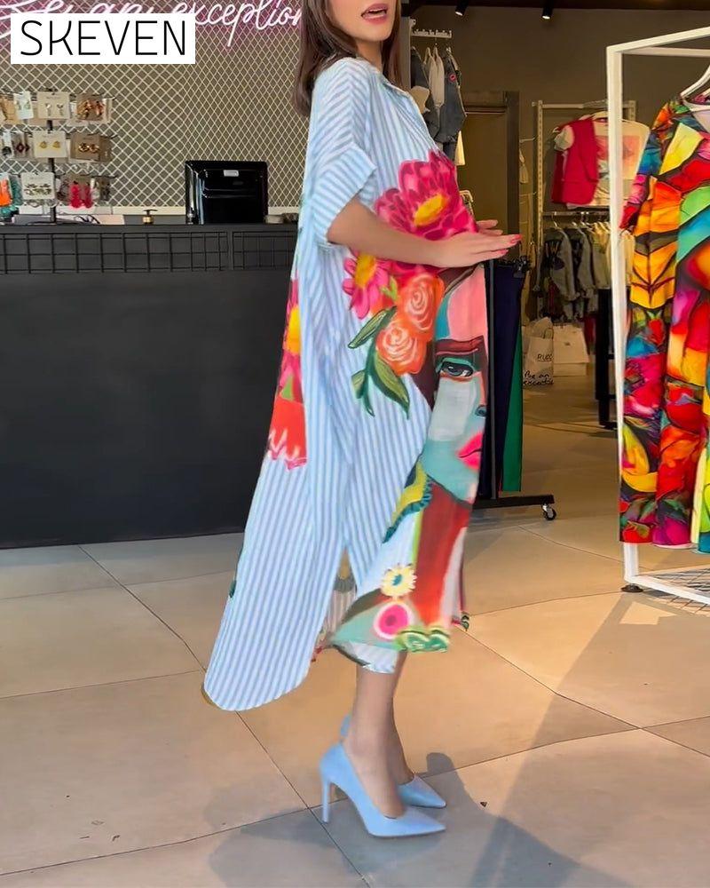 Bluse mit vertikalen Streifen und Charakterprint, Reversschlitz