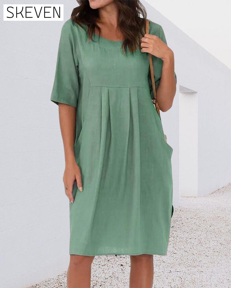 Robe unie à col rond et poches
