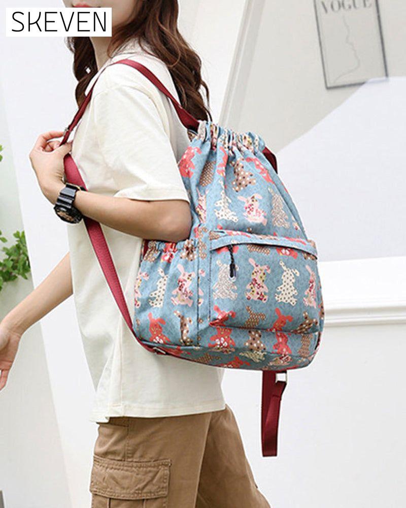 Schultertasche im Ethno-Stil mit Kordelzug