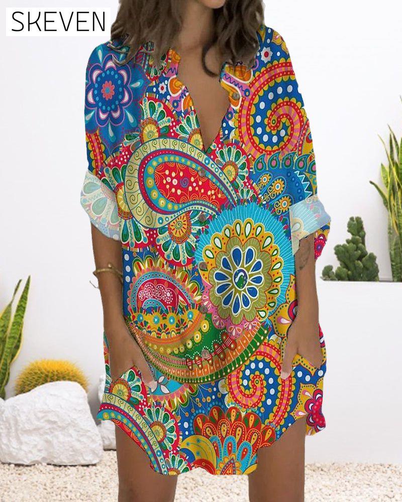 Bedrucktes Kleid mit Knöpfen, langen Ärmeln und Taschen