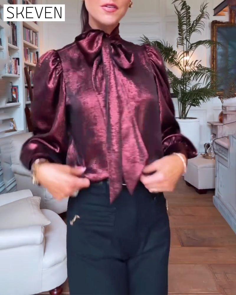 Elegante Bluse mit Puffärmeln und fließendem Band