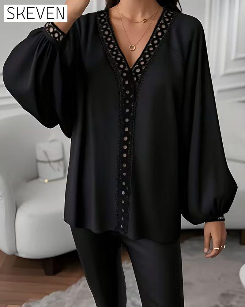 Lockere Bluse mit Laternenärmeln und V-Ausschnitt