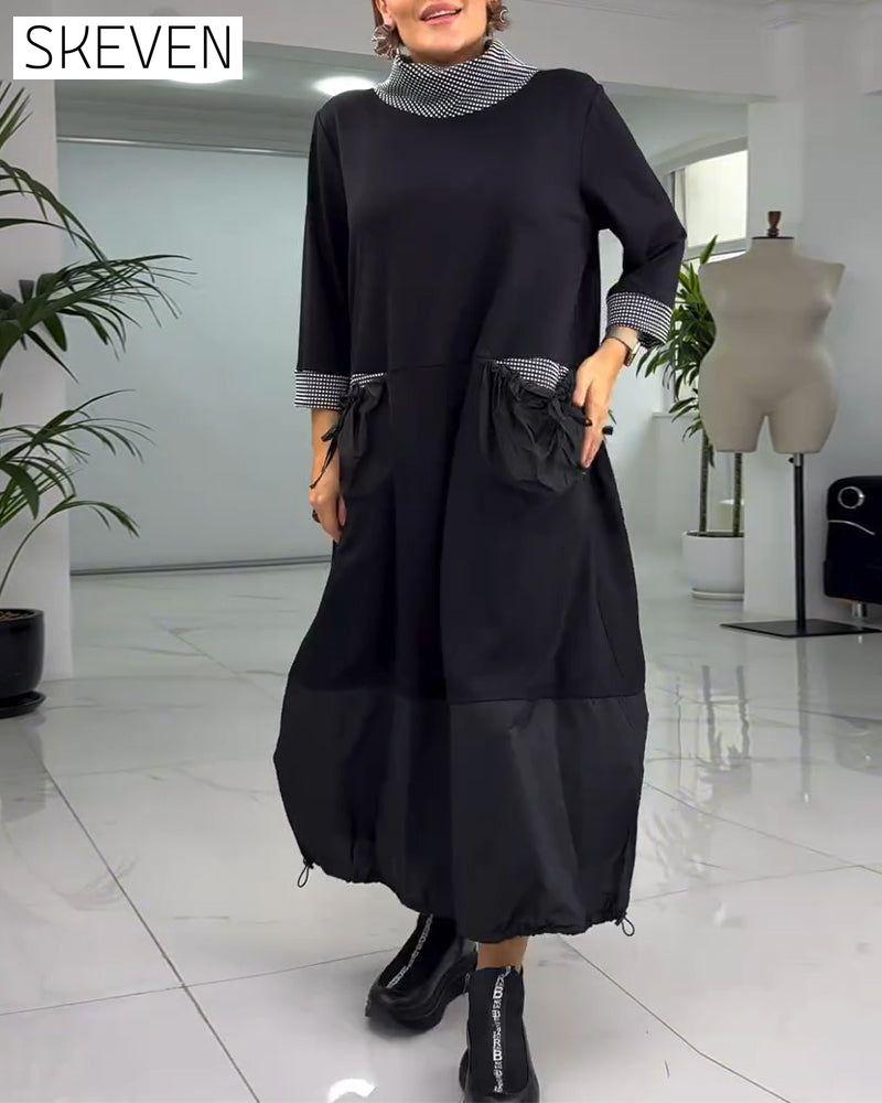 Lässiges Kleid mit Karomuster, hohem Kragen und Taschen
