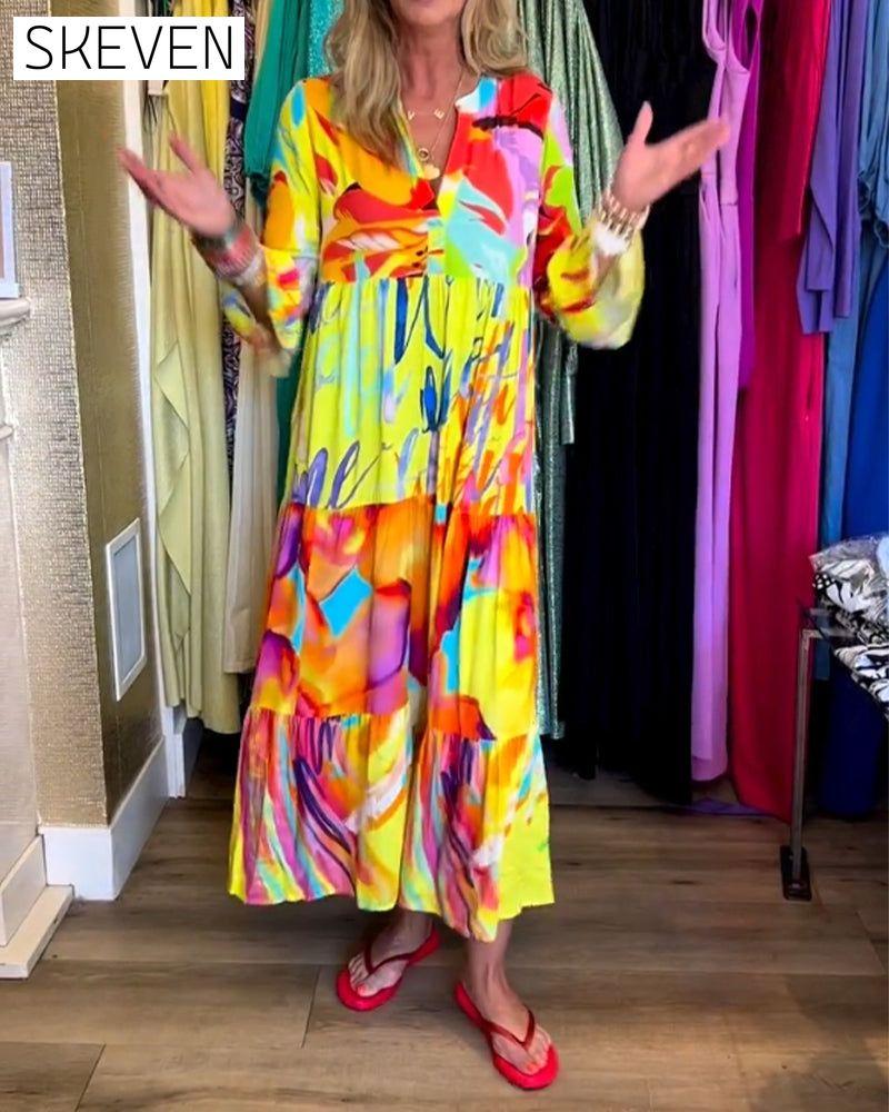 Bedrucktes Kleid mit ausgestellten Ärmeln