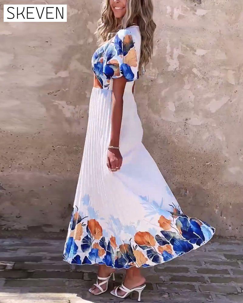 Kleid mit tiefem V-Ausschnitt und bauschigen Ärmeln