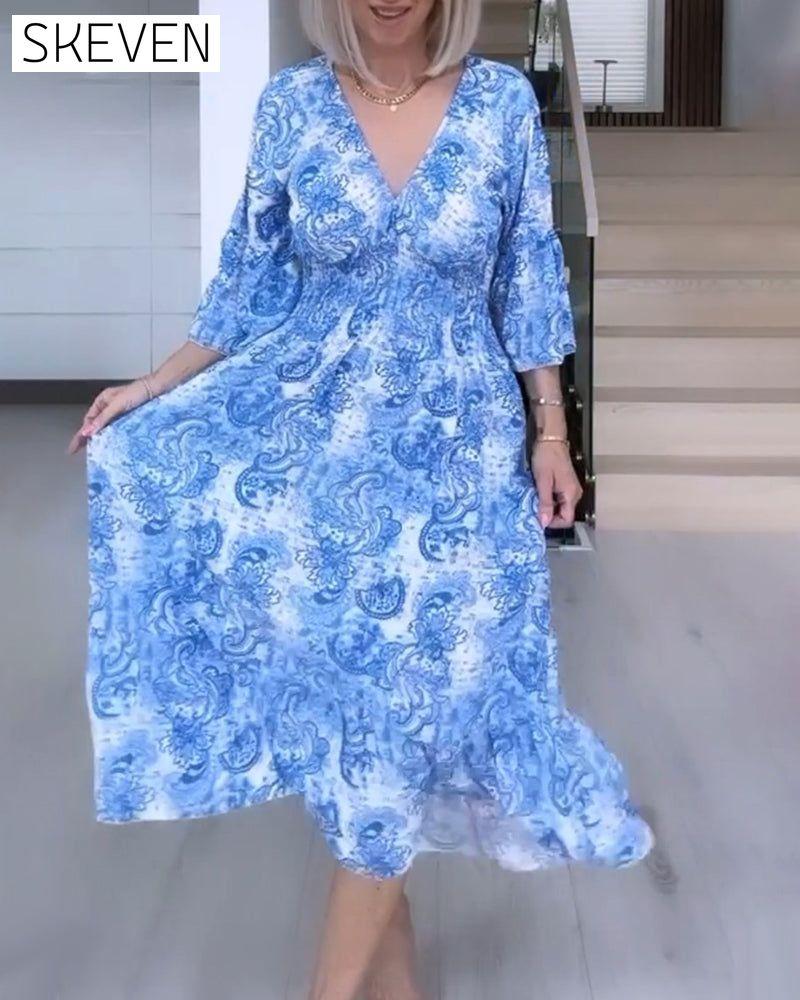 V-neck belted printed flowy dress