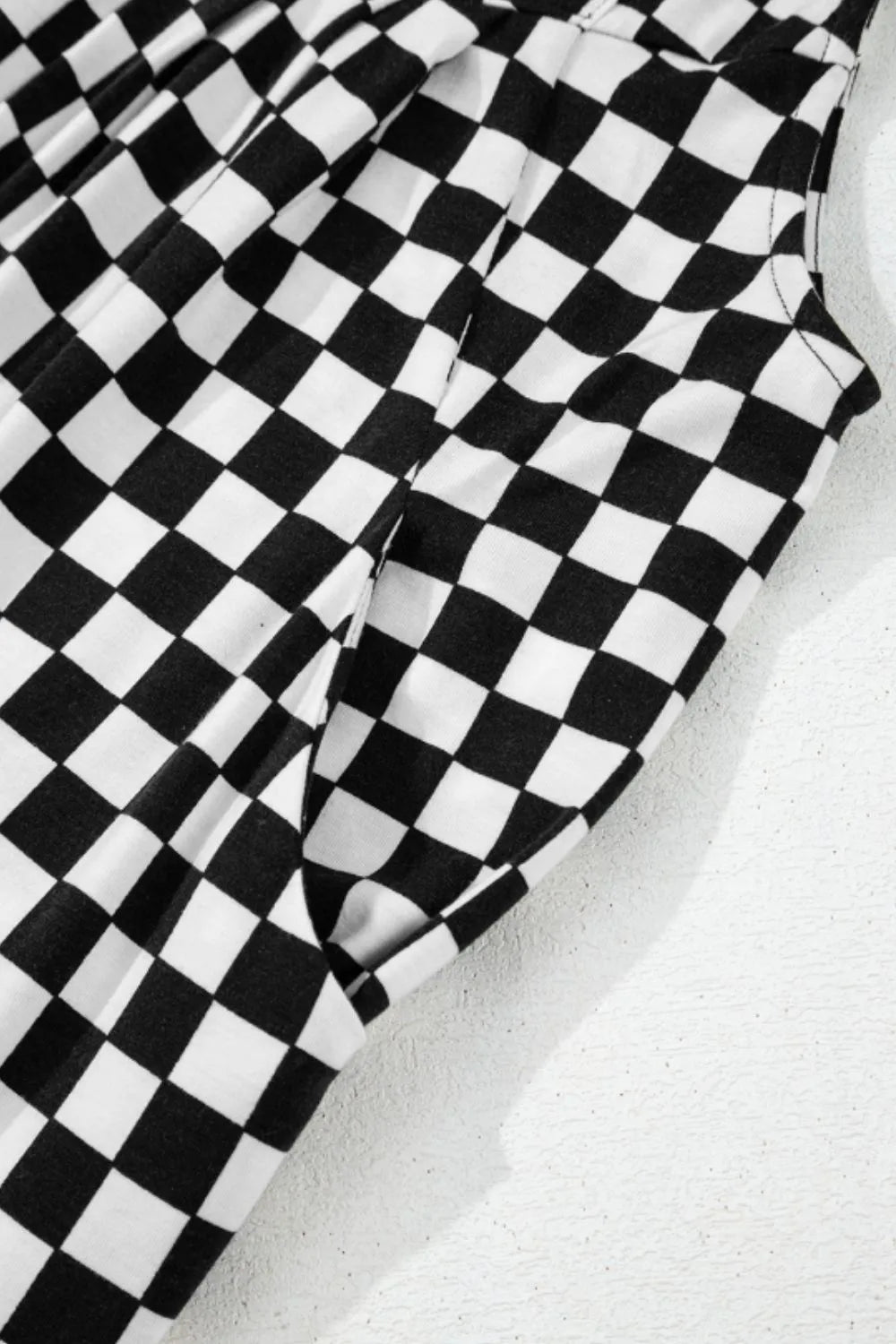 Jumpsuit mit Karomuster, Taschen und weitem Bein